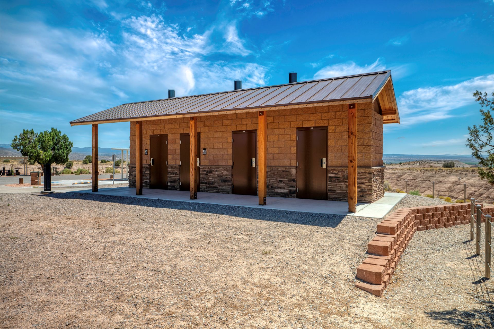 three stall vault restroom in the desert