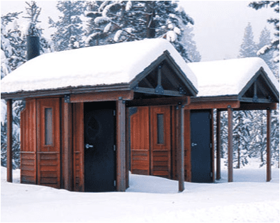 Pair of Single User Vault Restrooms in Winter Setting