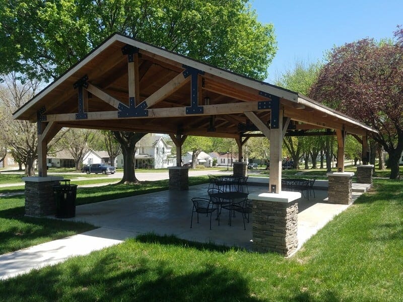 Attractive Pavilion Structure with Dramatic Trusses and Stone Wraps