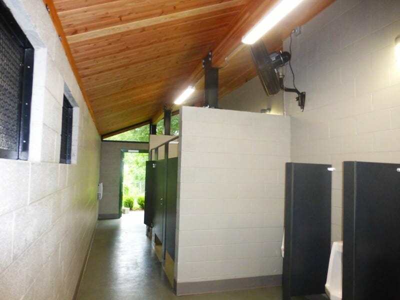 Combined Changing Room and Restroom with Concrete Privacy Stalls