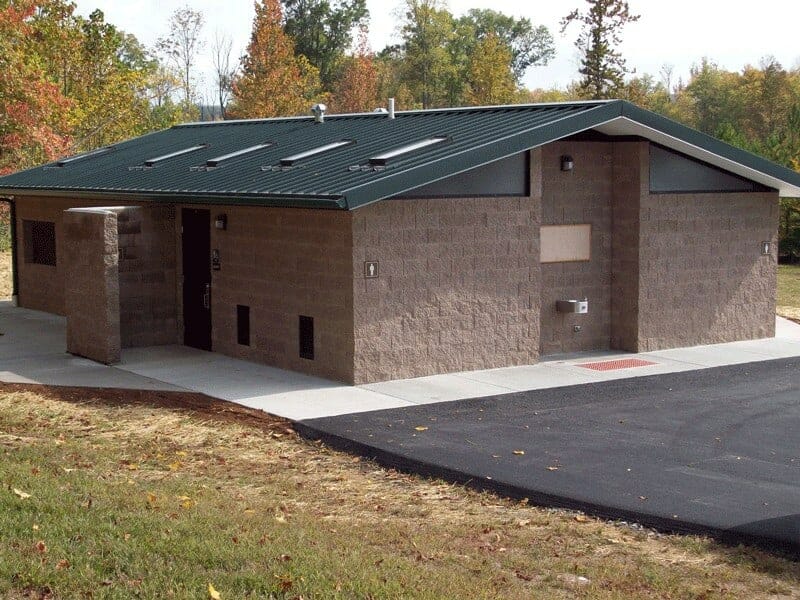 restroom-shower-with-green-metal-roof-privacy-wall-side-entry Medium Shower and Restroom Facility with Green Metal Roof and Side Entry