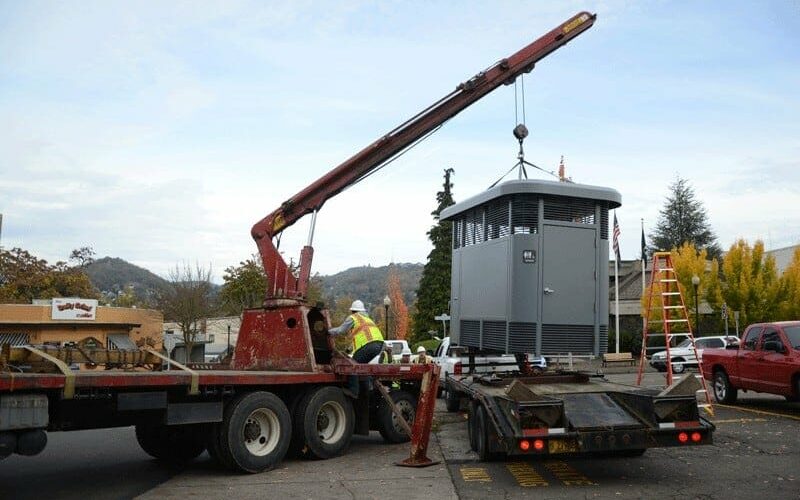 Crane Placing a Sidewalk Restroom