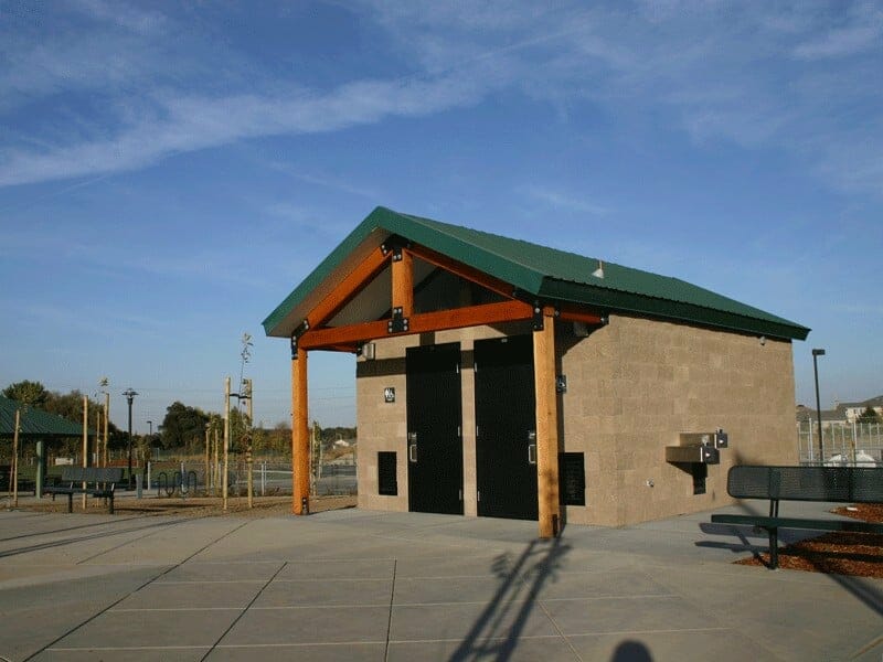 Compact Double Restroom with Attached Drinking Fountain