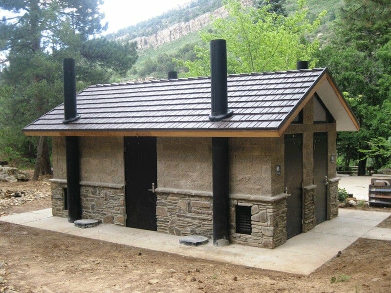 Waterless Restroom with Stone Wainscoting