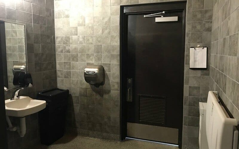 High Quality Restroom Interior with Tile and Porcelain Sink Fixtures