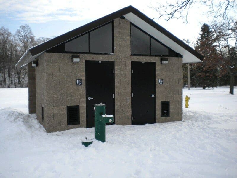 Simple Restroom Building in Snowy Setting