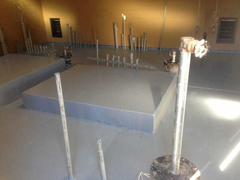 control-building-interior-with-raised-concrete-slabs Interior of Control Building with Site Specific Design