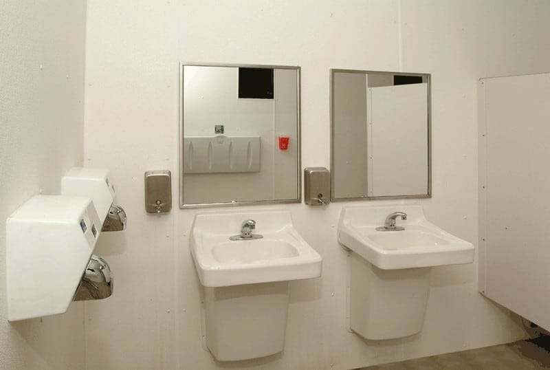 Clean Porcelain Sinks with ADA Lav Guards and Hand Dryers