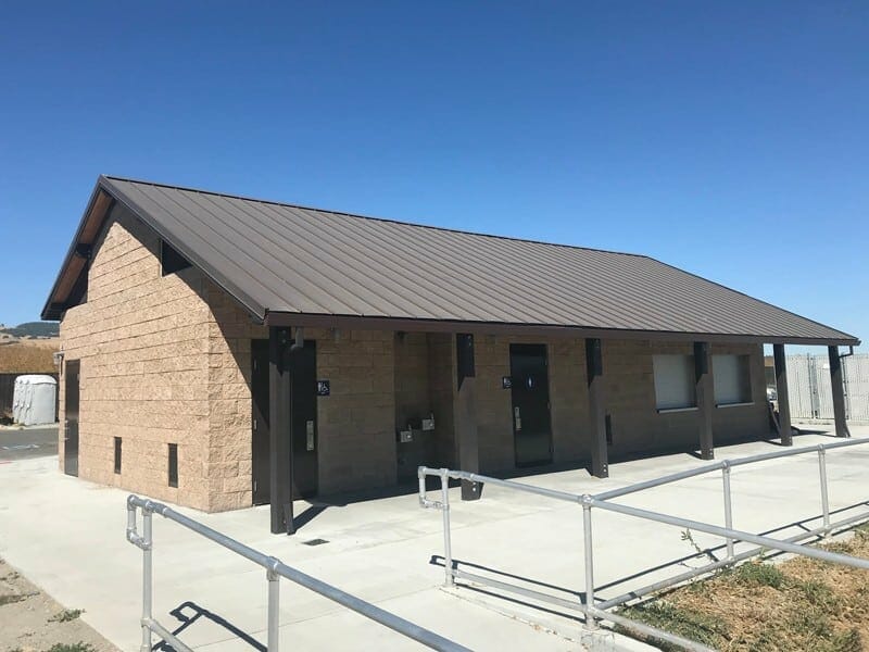 Large Concession Building with Multiuser Restrooms and Continuous Roof Overhang