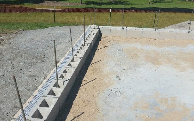 Insulated CMU Block Being Installed