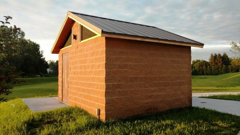 Restroom with Exterior of Concrete and Metal Roof