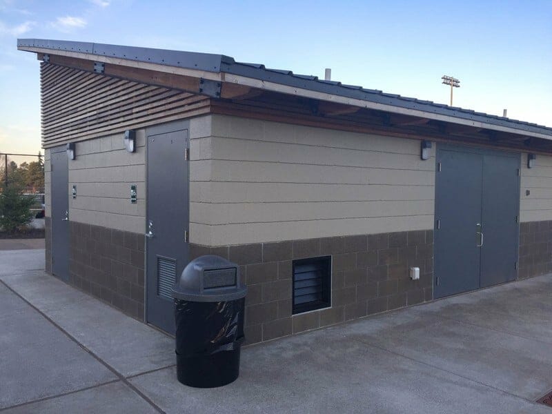 Painted CMU and Colored CMU Block Exterior with Wooden Slats