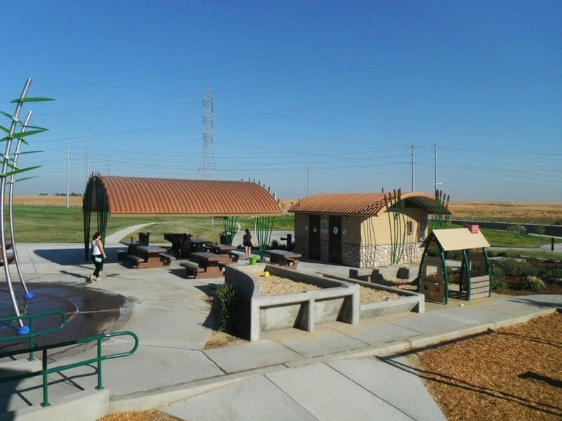 Curved Metal Roofs on Pavilion and Restroom in Unique City Park
