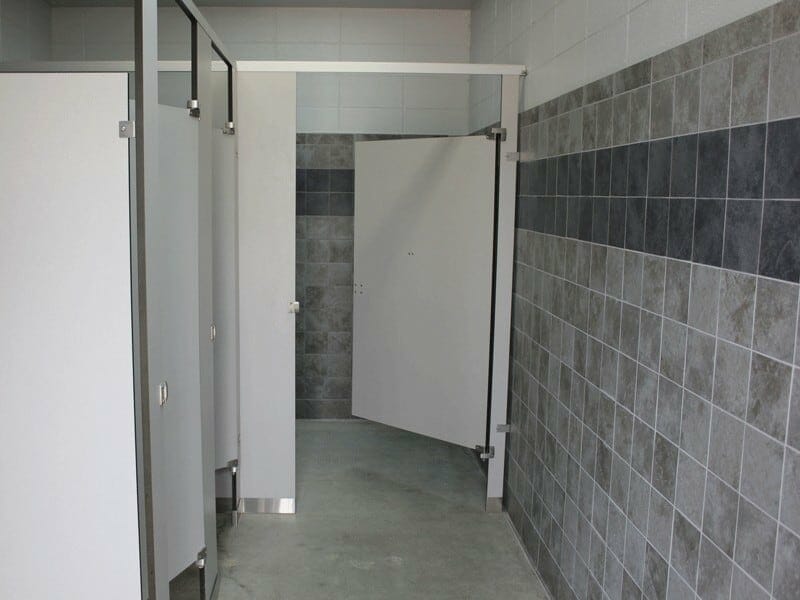 Attractive Restroom Interior wall with Grey and Blue Tile.