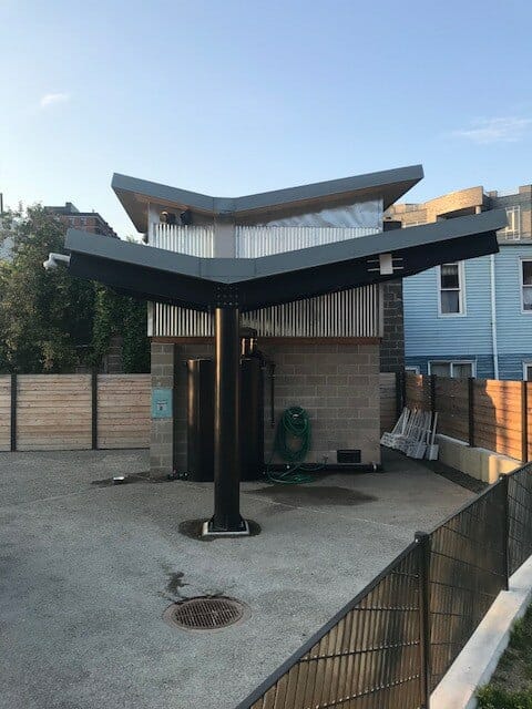 Two Level Roof with V-Shape to Collect and Distribute Rainwater into Filtering system