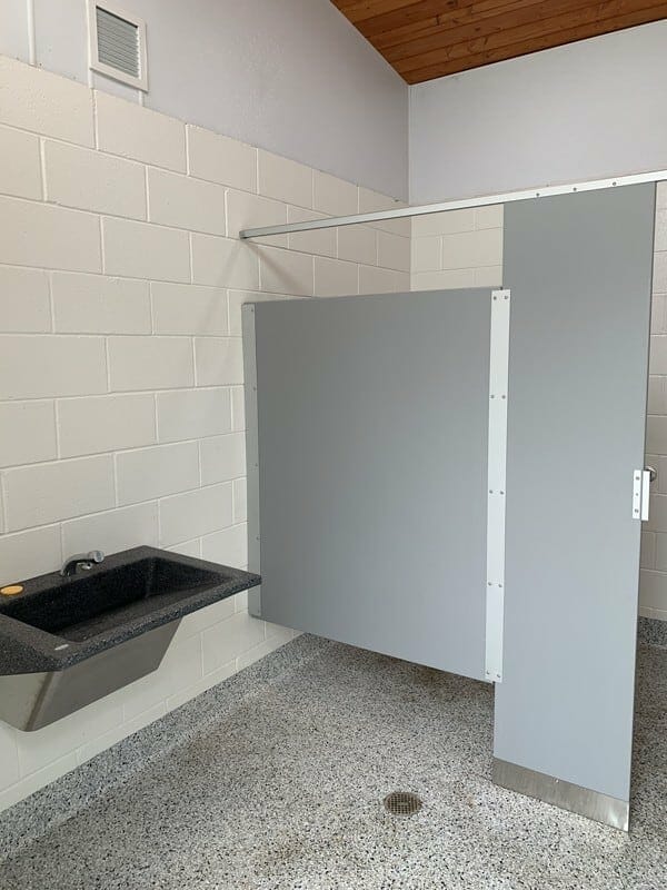 Restroom Interior with Accessible Sink and Stall