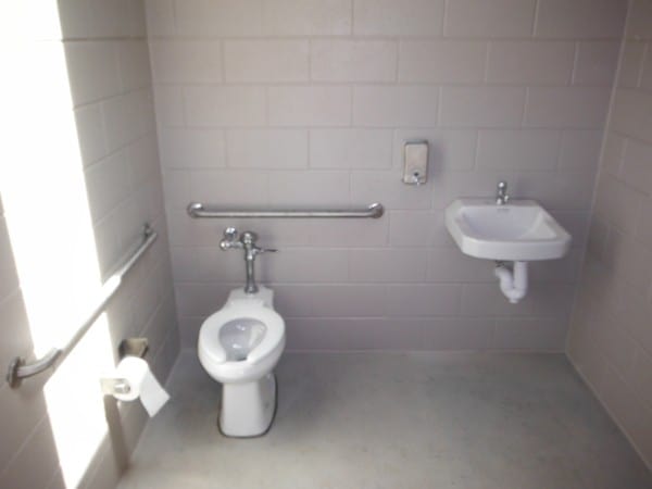 Restroom Interior with Porcelain Toilet and Sink