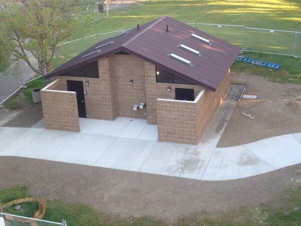 Multi User Restroom with Concrete Exterior and Skylights