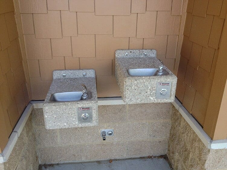 Stone Drinking Fountains on Public Restroom
