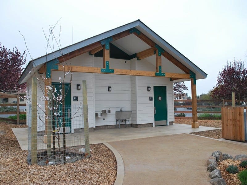 Restroom with Clean White Lap Siding and Extended Roof