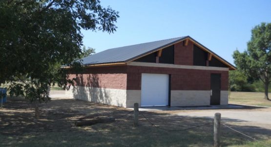 Bear Creek Park in Keller, TX Parks Maintenance Building with Two-Toned CMU Block and a White Roll-Up Door
