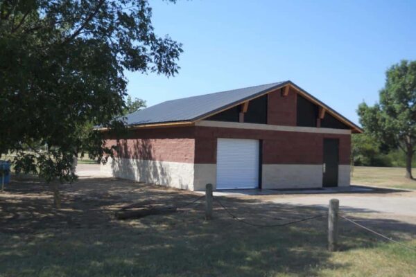 Bear Creek Park in Keller, TX Parks Maintenance Building with Two-Toned CMU Block and a White Roll-Up Door