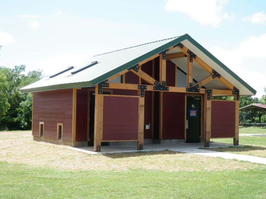 Large Restroom with Privacy Screens and Extended Roof at Entrance