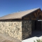 Extra Large Restroom with Stone Siding and Privacy Walls