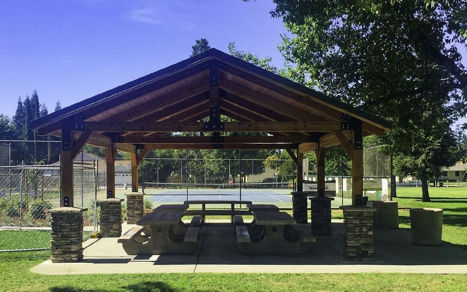 Large Wood Pavilion with Stone Wrapped Posts at Public Park