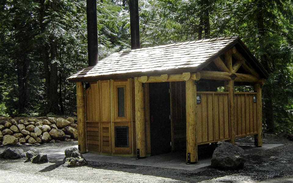 Double Vault Toilet Structure with Log Porch Roof Extension