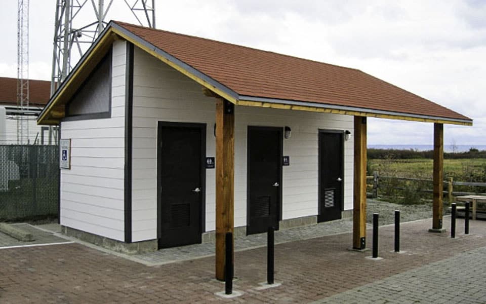Large Waterless Bathroom with Hardi Lap Siding at Memorial Site