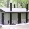 Large Waterless Restroom with Green Board and Batten at Campground Site