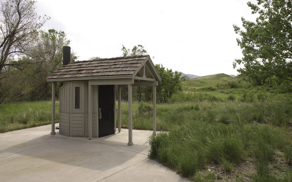 Painted Lap Siding on a Single Occupant Waterless Restroom