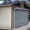 Small Storage Building with Steel Rollup Door and Stucco Exterior