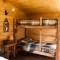 Log Bunk Beds in Small Prefabricated Cabin