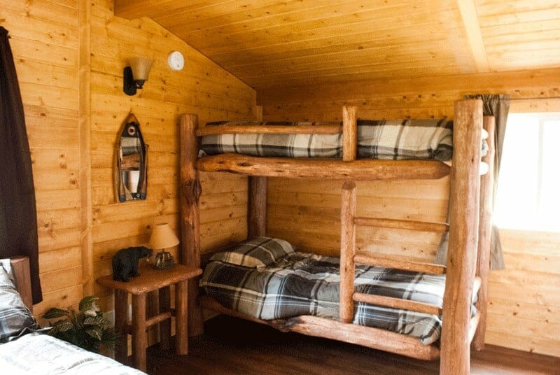 Log Bunk Beds in Small Prefabricated Cabin