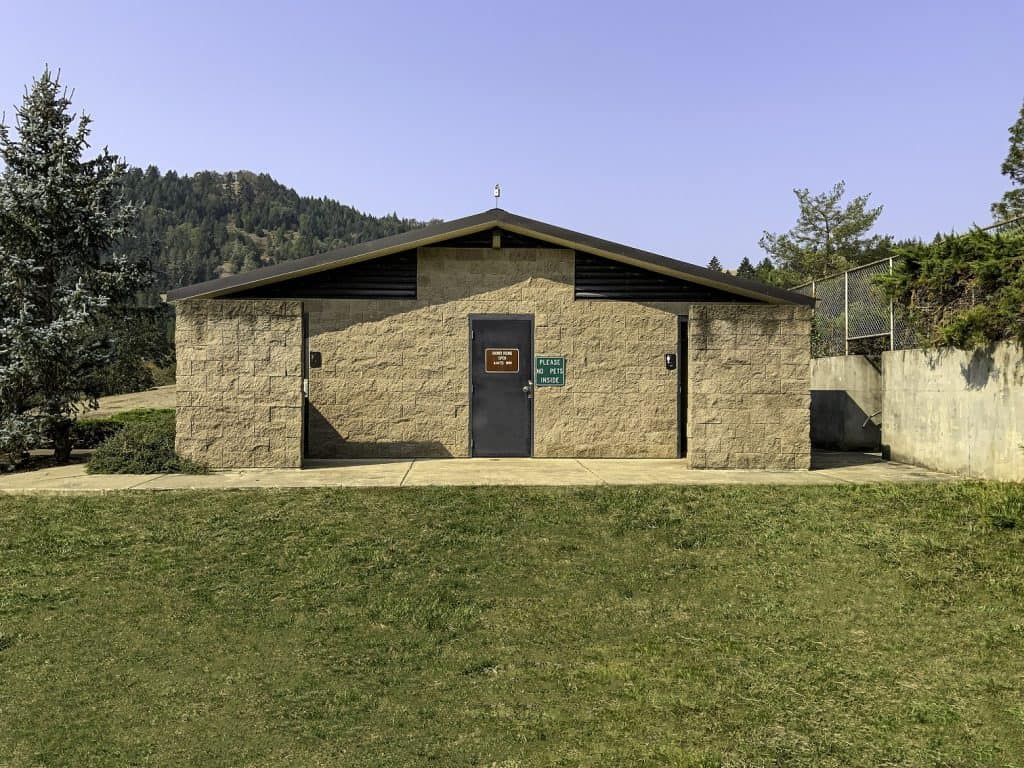 medium-shower-restroom-with-concrete-block-structure Medium Shower Building with Toilets and Privacy Walls at Entrance