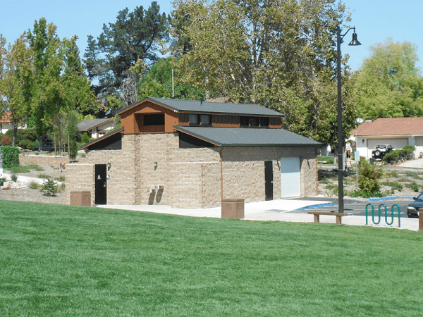 Public Restroom with Storage Room for Vehicles and Unique Roof Structure