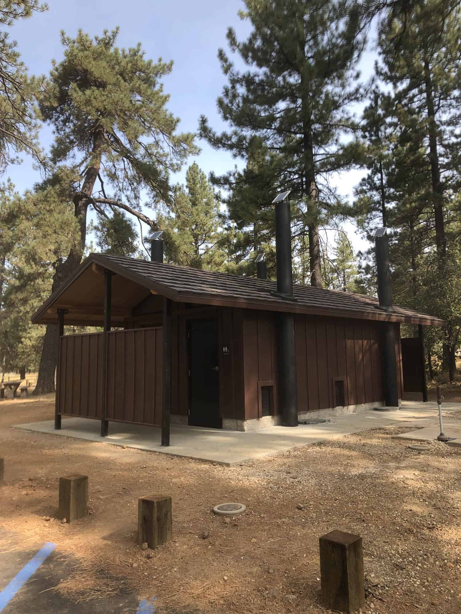 four waterless restrooms with natural exterior colors