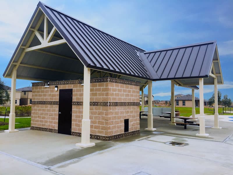 Separate Restroom and Shelter Structures with Matching Color Scheme