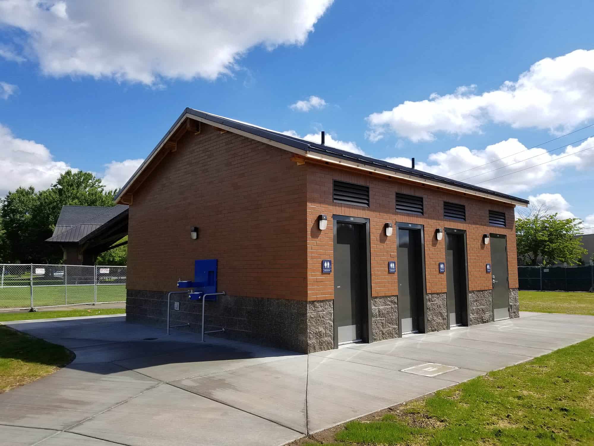 Brick restroom building with steel fixtures