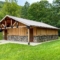 Extra Large Showers Building with Bathrooms with Stone Wainscot