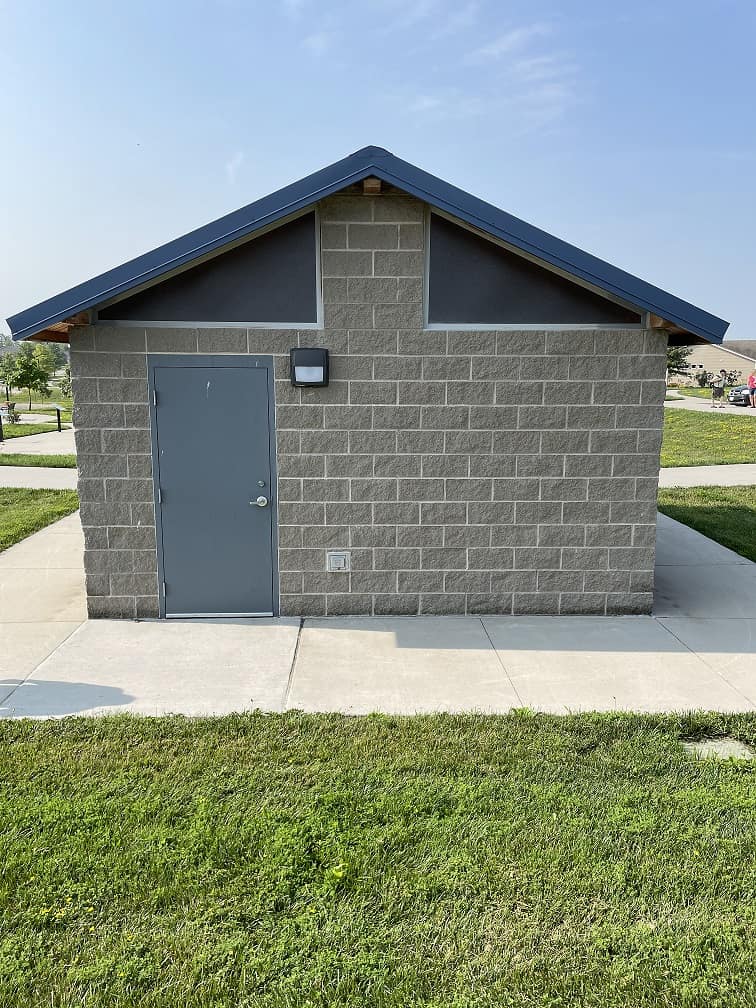 rear of a restroom building with mechanical and utility space