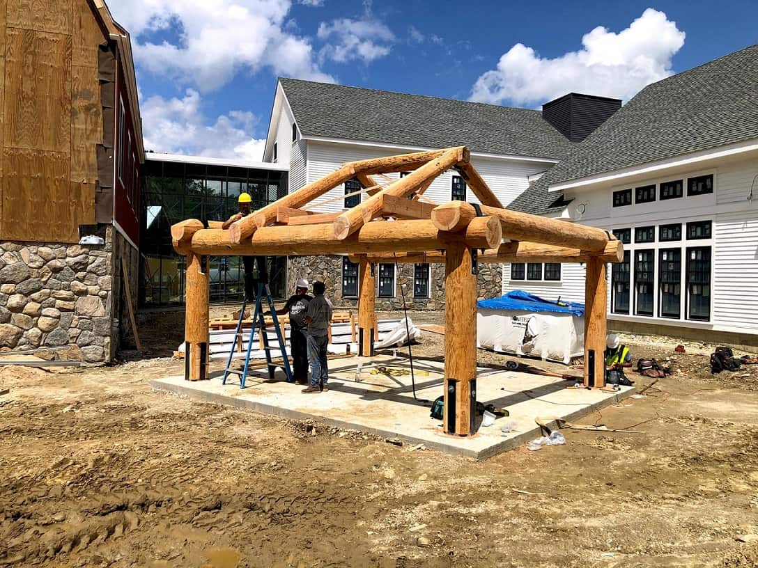 Log pavilion in construction for bus station