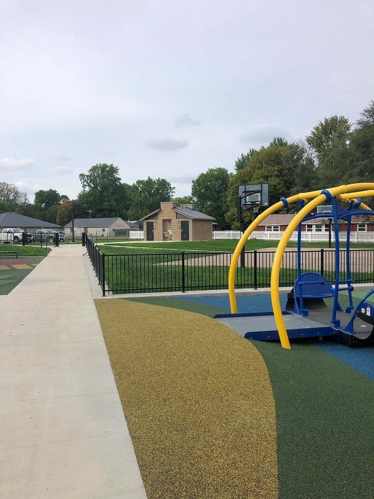 Pella-Kiwanis-Inclusive-Playground Accessible Playground with Accessible Restroom Building
