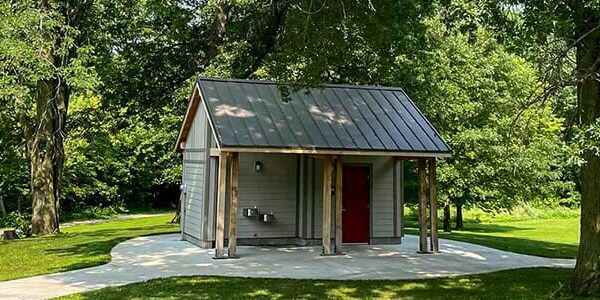Flood proof restroom with custom siding