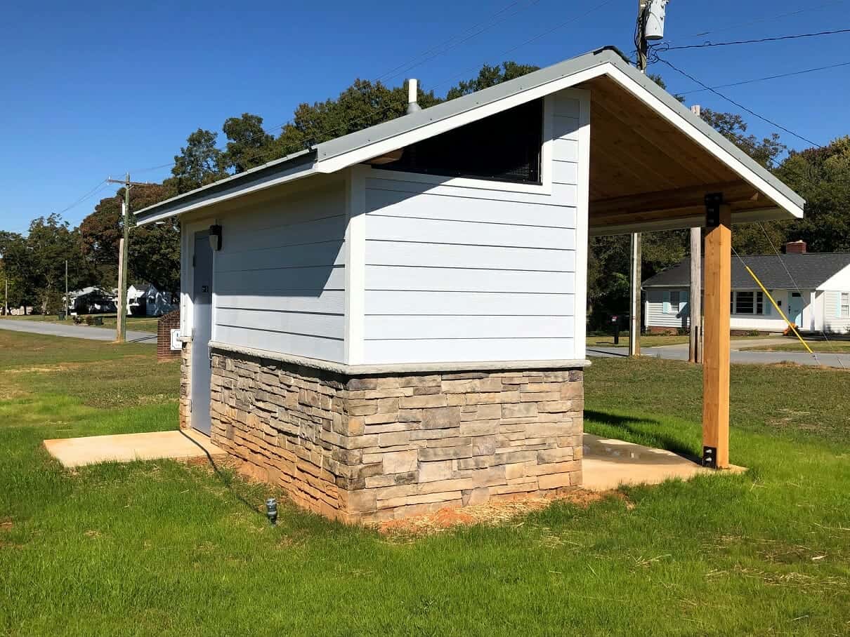 Simple Bathroom Building with Stone Exterior