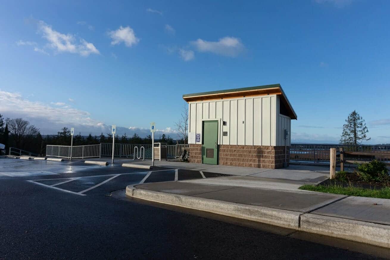 green steel door and brick base on restroom
