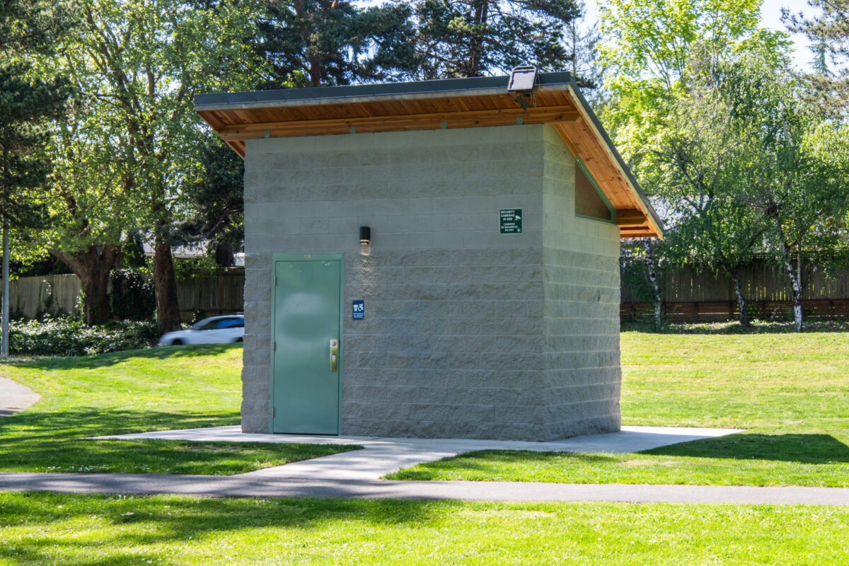 a single user restroom building with a single slope
