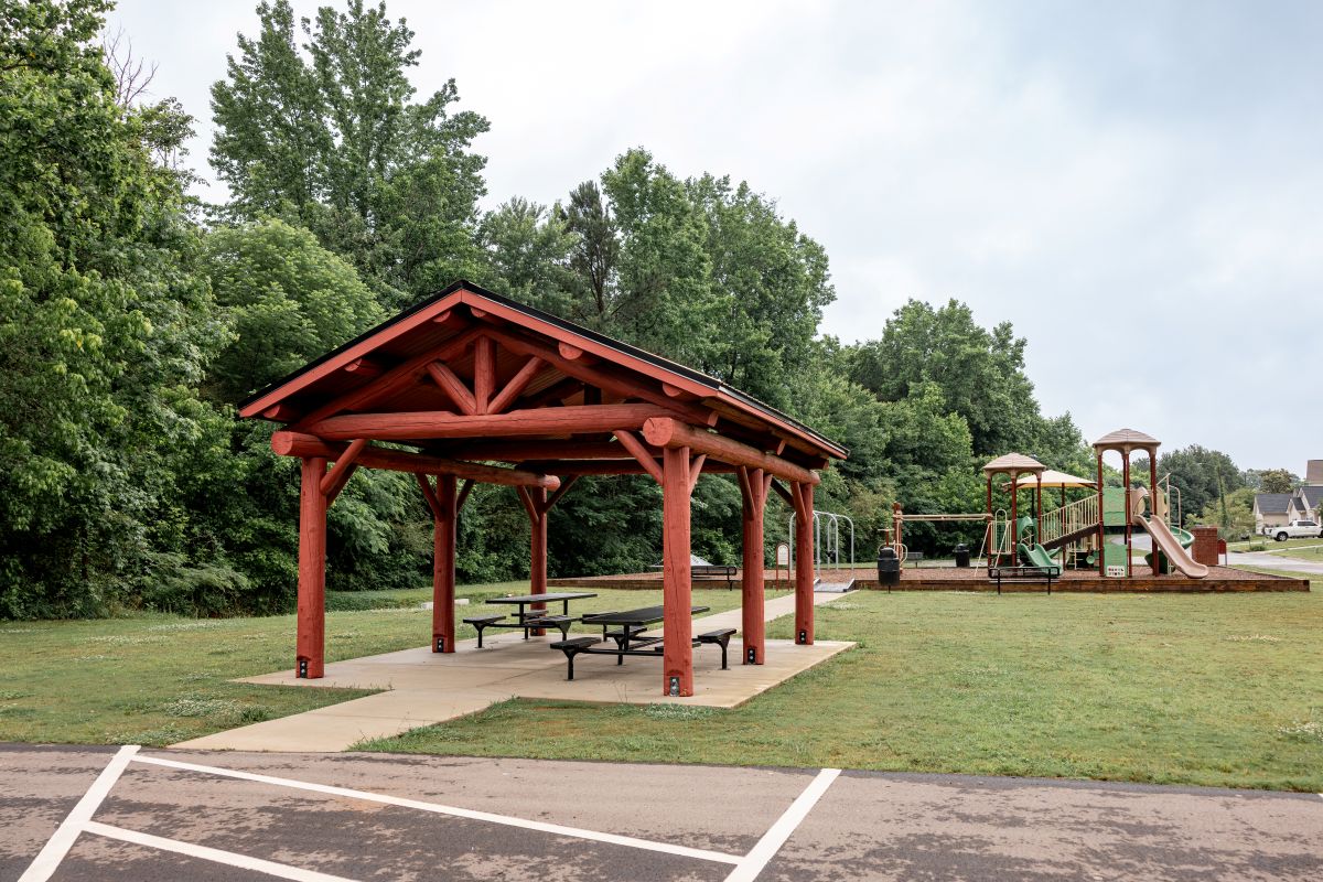 Red stained log pavilion